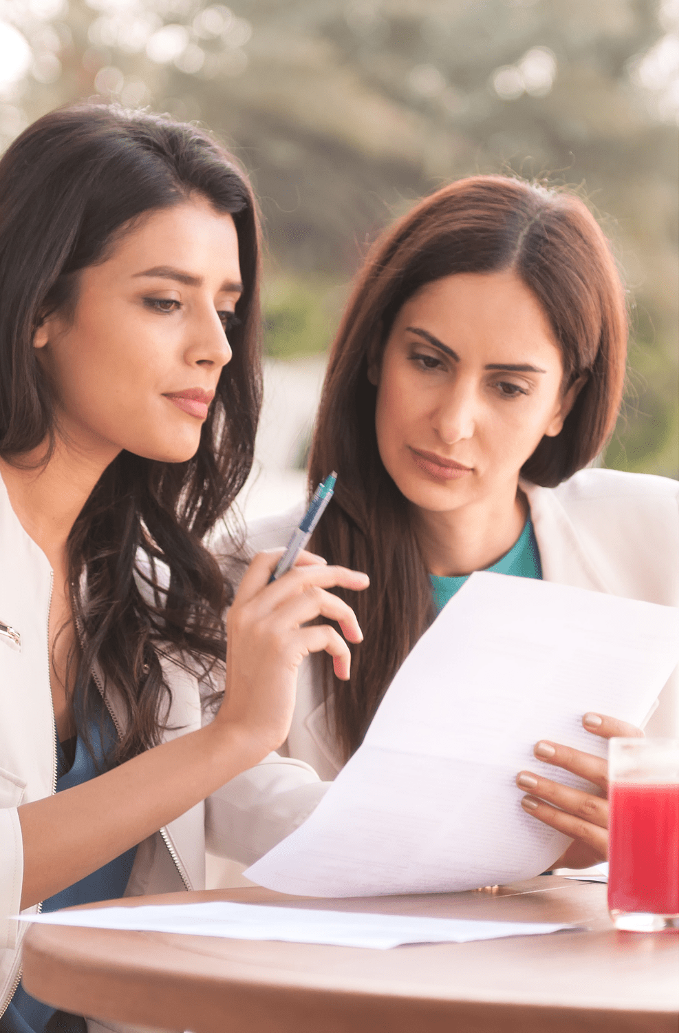 A woman discussing something woth a nother woman. The women are part of a go-to community - a peer society, where women help each other to secure their lifestyles for life.