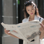 Woman reading a newspaper—shortlisted tips to navigate the infodemic and make sense of the news
