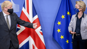 Boris Johnson and Ursula von der Leyen, masked, speaking in front of UK and EU flags during Brexit talks.