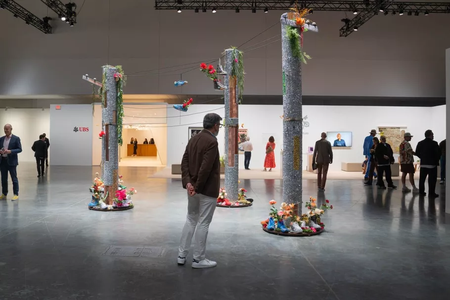 Installation view of Art Basel in Miami Beach with curious and inspired visitors- the Curated Letter and the Art Basel Miami are curated for a similar purpose-to help you become the most interesting woman in the room.