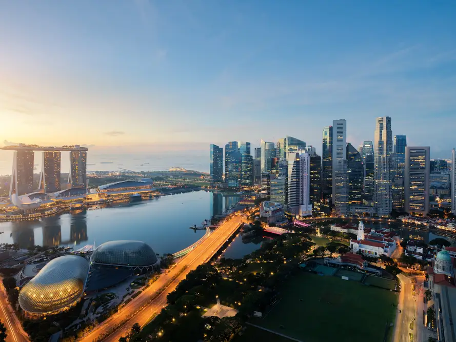 Curated Letter February–March 2023: Skyline of Singapore during sunset depicting elegant sophistication.