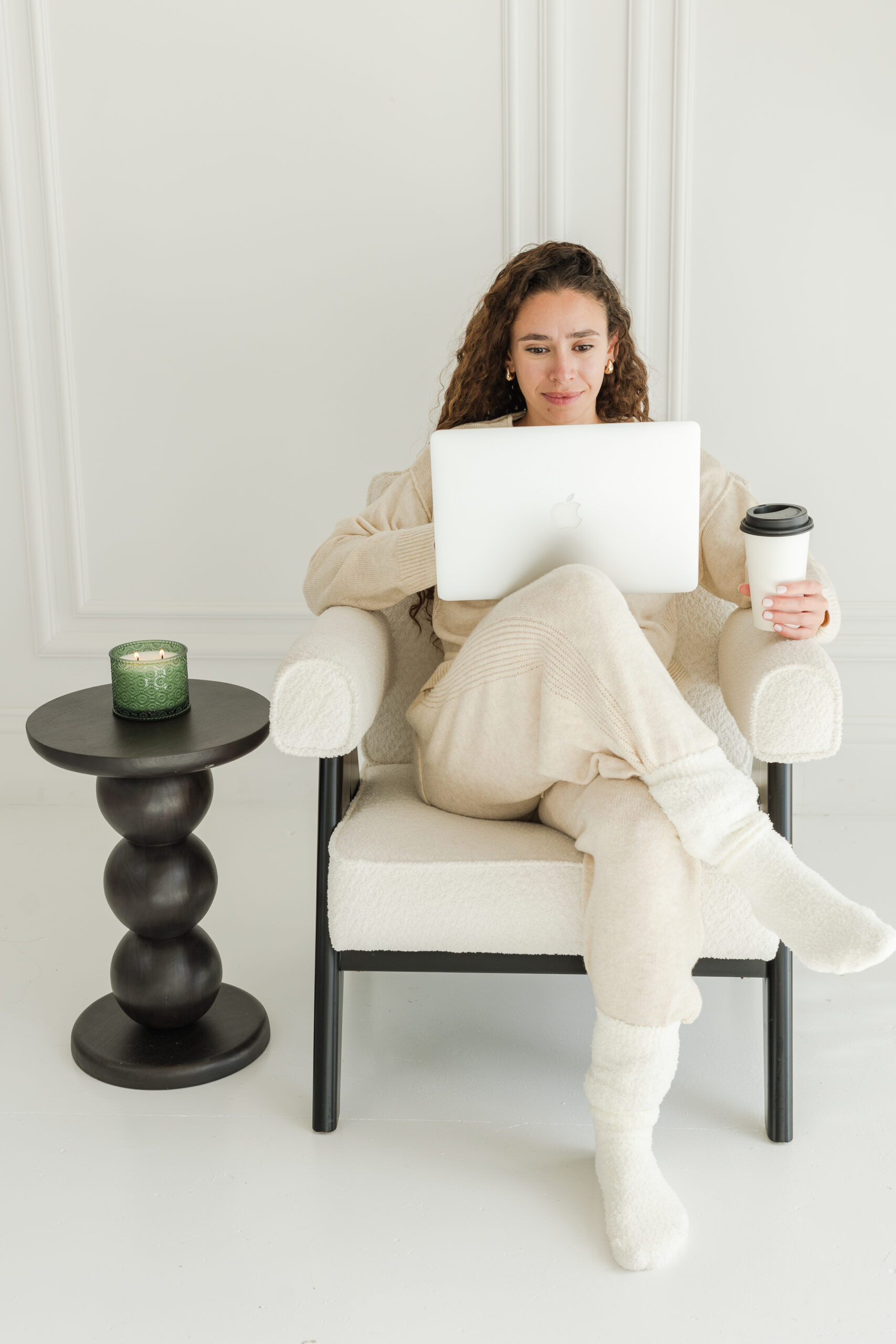 Woman enjoying some relaxation time while exploring her money mindset and contemplating about booking money mindset mentoring sessions after the editorial revamp to improve her financial savvy